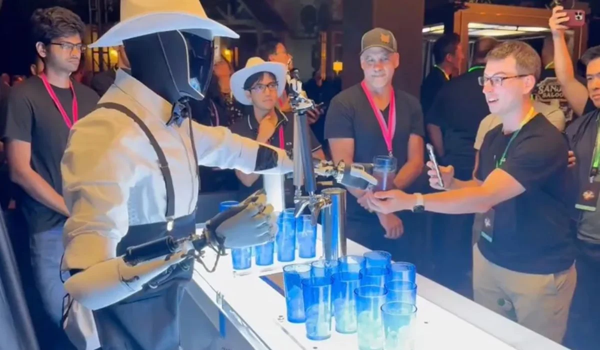 Optimus Humanoid Robot Pouring Drinks At The Robotaxi Event