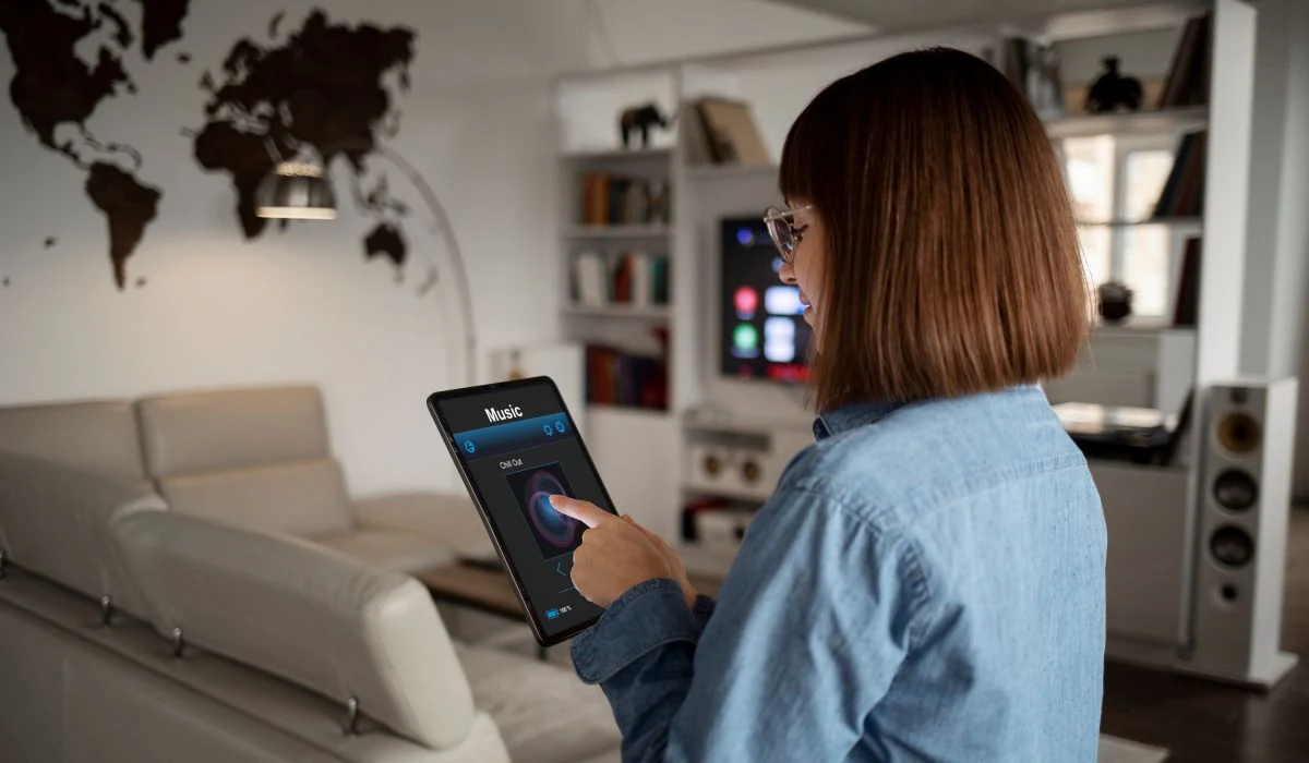 A young lady using smart home devices.